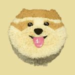 Dog face cake with light cream and brown fur texture and a big smiling expression.