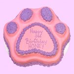 Pink and purple paw cake in paw shape with custom text on top