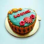 Floral bone-shaped cake with turquoise icing and colorful flowers