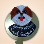 Realistic dog face cake design as a Shih Tzu with detailed fur piping and red tongue