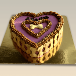 Heart-shaped dog cake with purple frosting and bone-shaped biscuits around the edges.