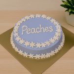 Purple cat-friendly cake with white floral border